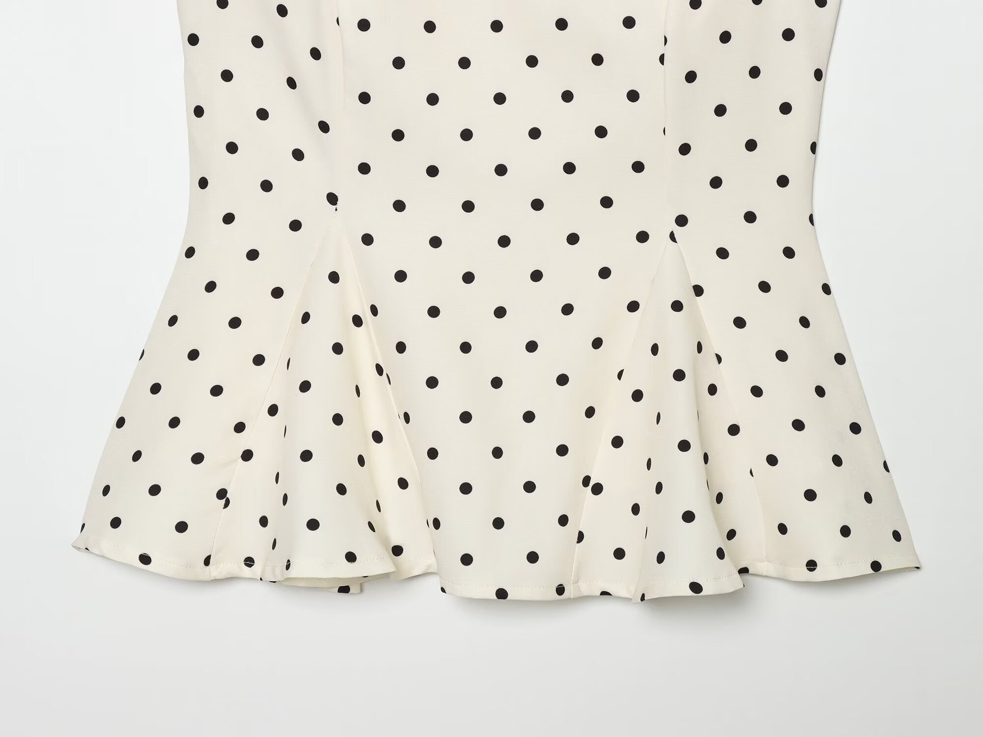 Women's ruffled hem polka dot sleeveless top